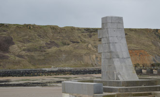 Monument to the liberation of Europe on Port-en-Bessin harbour wall